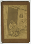 390091 Meisje met peuter op schoot in de deuropening, ca. 1890