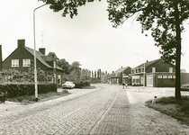 13304 Dorpsstraat, met links een slagerij en rechts een cafe, 16-06-1966