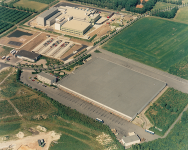 243306 Luchtfoto van Industrieterrein Breeven, 1989