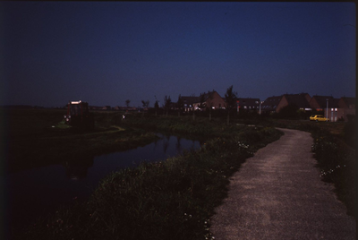 DIA42811 Woonwijk Vogelenzang, gezien vanaf de Lageweg ter hoogte van de Jan Damenweg. Een tractor maait gras; September 1988