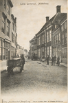 1912 Lange Gortstraat, Middelburg. Gezicht op de Lange Gortstraat te Miiddelburg en poserende personen