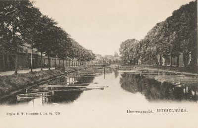 1929 Heerengracht. Middelburg. Gezicht op de Herengracht te Middelburg met boomstammen in het water