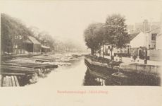 2186 Beenhouwerssingel - Middelburg. Gezicht op de Beenhouwerssingel te Middelburg met boomstammen in het water