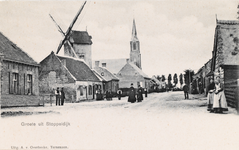 7802 Groete uit Stoppeldijk. Gezicht op een straat te Stoppeldijk met de standerdmolen en de R.K. kerk