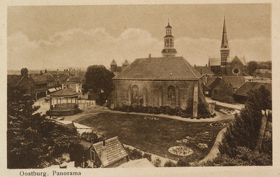 8391 Oostburg. Panorama. Gezicht op Oostburg met de muziektent, de Ned. Herv. kerk en de R.K. kerk