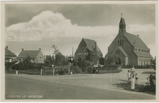 LEW-P-5 Groeten uit Lewedorp. De Rooms-katholieke kerk en pastorie aan de Burgemeester Lewestraat te Lewedorp