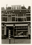 13647 Badhuisstraat 55, ongeveer ter hoogte van de Paul Krugerstraat. Ventevogel & zoon assurantiën.